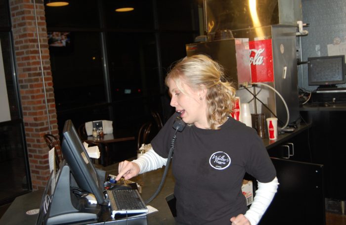 attractive woman taking an order at walter's303 pizzeria
