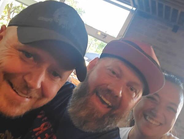 two handsome, bearded men drinking and enjoying walter's303 pizzeria